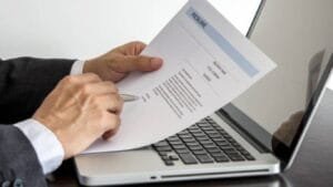 Recruiter using LinkedIn search filters and keywords to find qualified candidates online